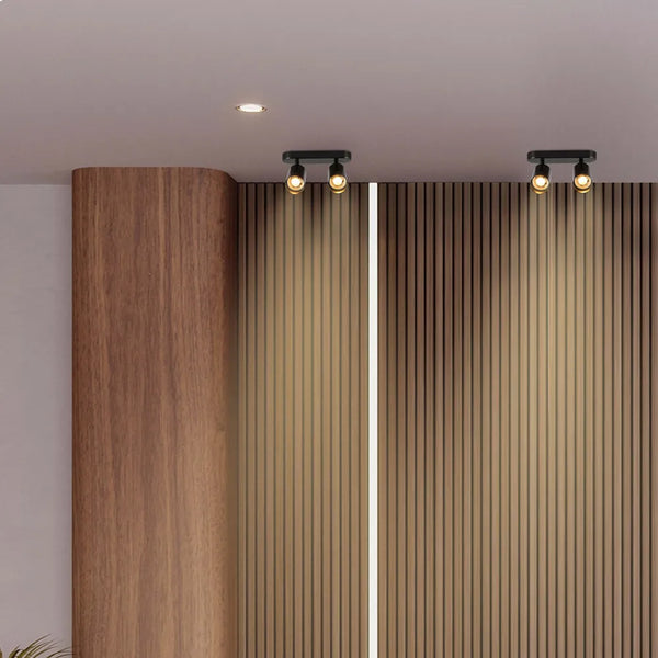 Modern pearl grey cylinder spotlight illuminating a chic living room with minimalist decor and soft, warm ambiance. Perfect for stylish lighting.172-030392