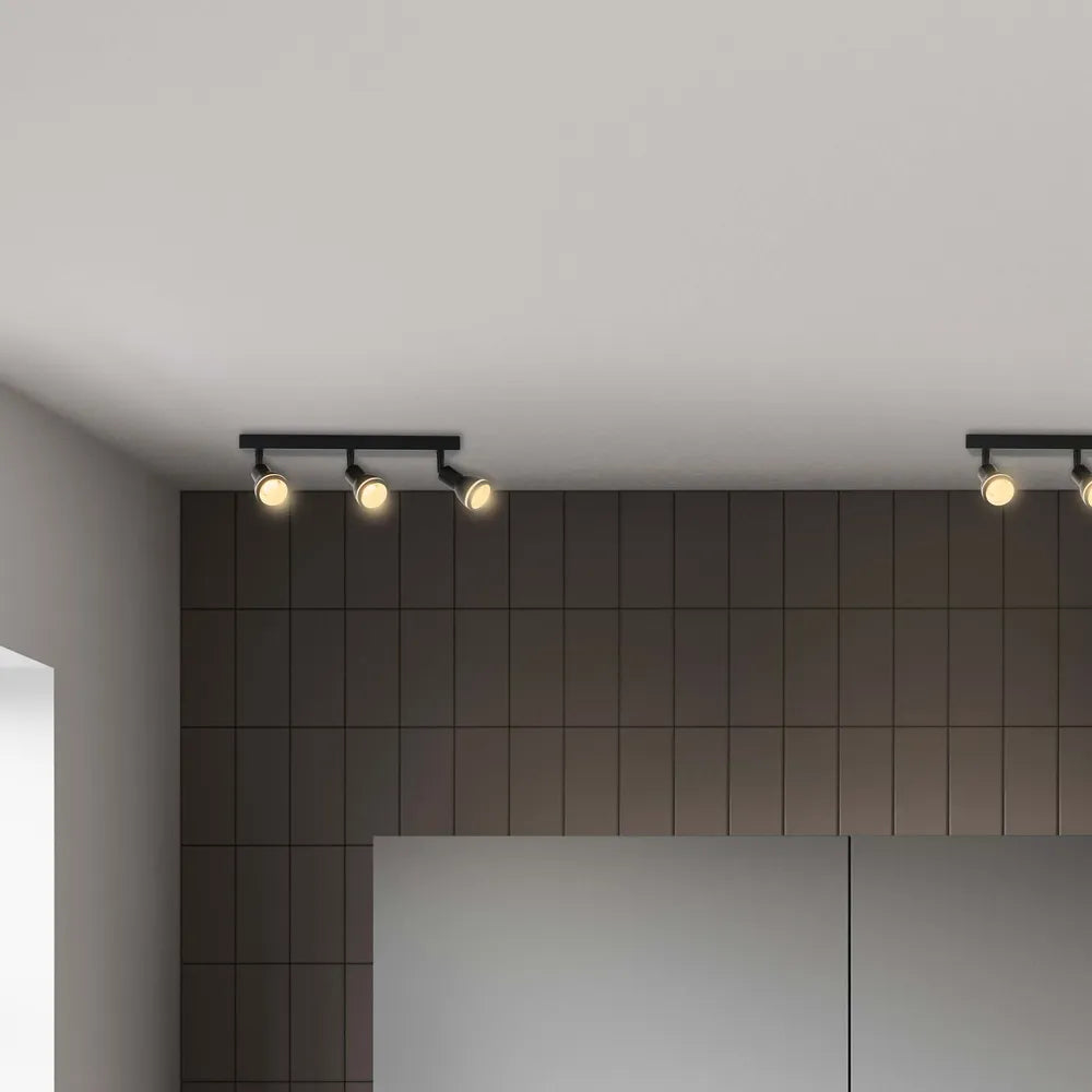 Modern Luma Cylindro GU10 spotlight fixture illuminating a stylish living room with contemporary decor.172-03212