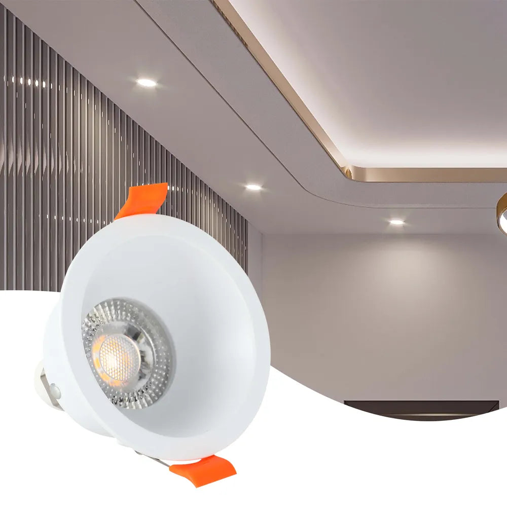 Modern GU10 downlight fixture illuminates a stylish living room with elegant decor, providing low-glare lighting for a cozy atmosphere.143-03997