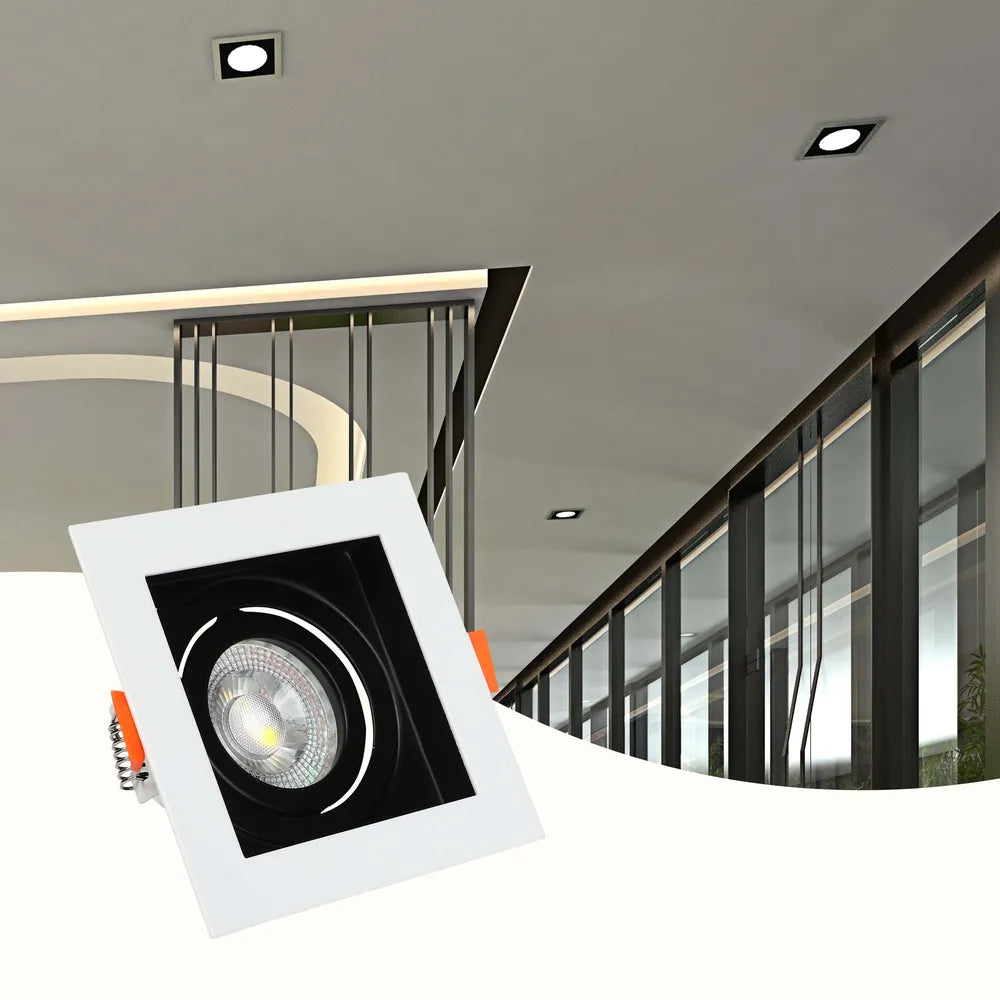 Modern GU10 downlight fixture illuminating a stylish living room with sleek decor, enhancing the ambiance with adjustable lighting.143-03440